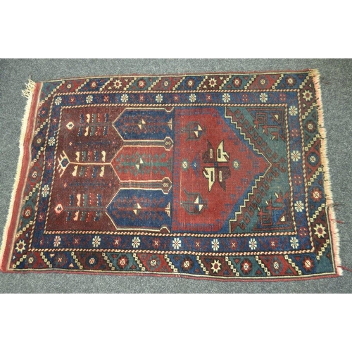 382 - A hand woven throw rug, geometric designs in blue, cream and taupe on a Burgundy ground. 120cm x 85c... 