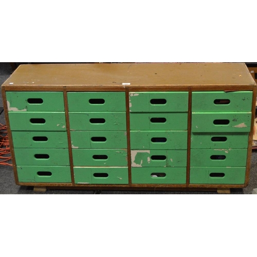 391 - A twenty drawer utility chest. 63cm high x 125cm wide x 35cm deep.