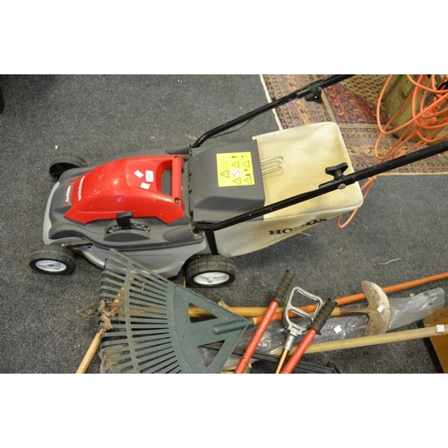 393 - A Honda HRE370 electric lawnmower; a Vax carpet shampooer; a bench grinder; an electric tile cutter;... 