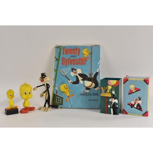 307 - A Tweety & Sylvester annual, 1975; a Tweety Pie figure, in plastic; a Tweety pencil sharpener, 1977,... 