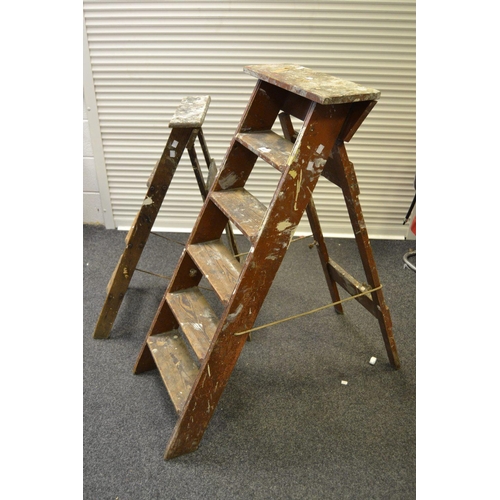 397 - Two sets of wooden stepladders.