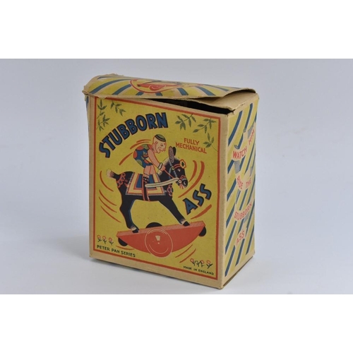 33 - A Stubborn mechanical wind-up Clown on  aDonkey horse,by Peter Pan, made in England, original box, c... 