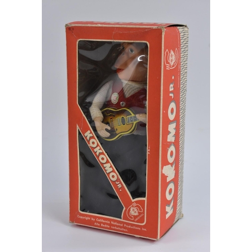 38 - A California National Productions Inc Kokomo Jr., playing a guitar, plastic and tin, in original box... 