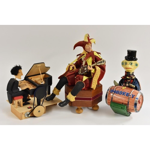 49 - A wooden automaton, piano player;  a clockwork automaton Jester, with a lute,  his  right arm moves;... 