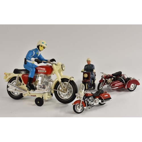 52 - A Japanese Honda motorcycle,  with rider, who does wheelies, battery operated, plastic, made in Japa... 