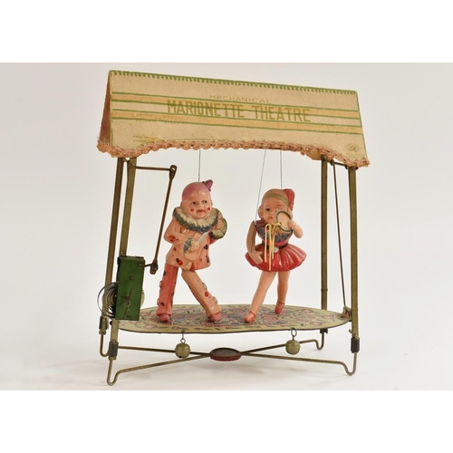 54 - A Marionette Theatre, mechanical, with celluloid figures, tin theatre, clockwork, made in Japan, c.1... 