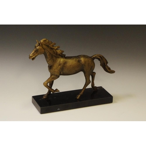 67 - A bronzed cast iron stallion in full gallop sculpture on marble base