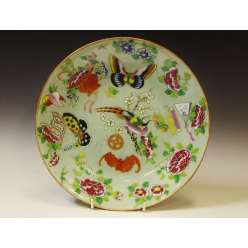 87 - A 19th century Cantonese circular plate, decorated with butterflies, fanciful birds, peonies, mons a... 