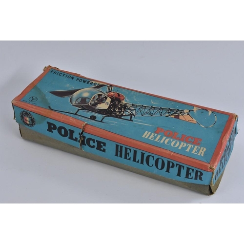 77 - A Fiction Powered Police helicopter, made in Japan, in original box; a tinplate Airport and Helicopt... 