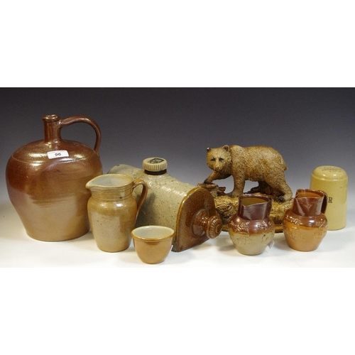 96 - Two salt glazed jugs applied with tavern scenes; other , flagons, hot water bottle; chalkware bear, ... 