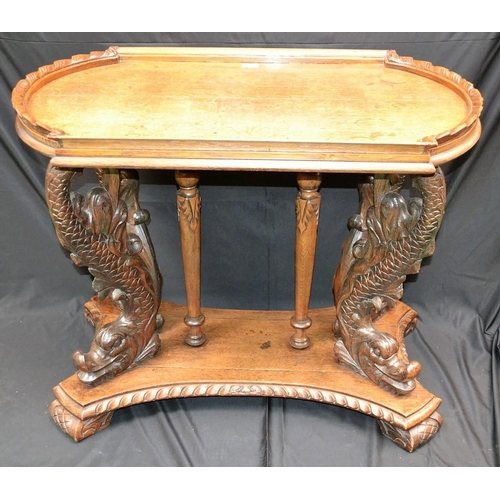 1575 - A 19th century German Baroque style oak centre table, rounded rectangular dished two-piece top above... 