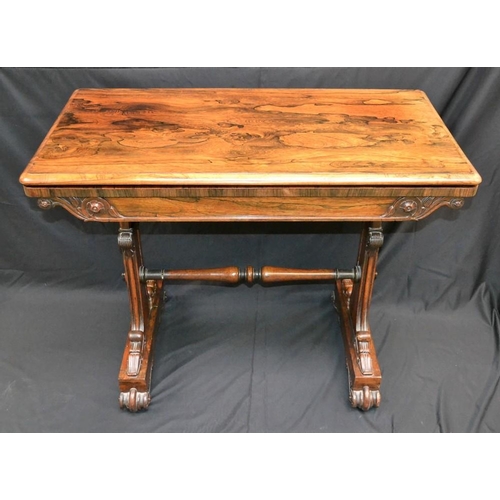 1577 - A William IV rosewood rounded rectangular card table, the bipartite pivoting top enclosing a circula... 