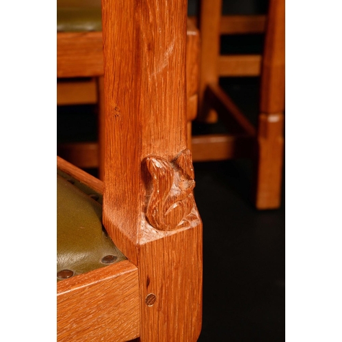 1579 - Wilf Hutchinson, Squirrelman - a set of ten oak dining chairs, comprising eight side chairs and a pa... 