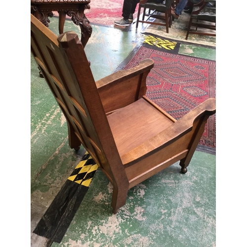 1580 - Robert Thompson, Mouseman of Kilburn - an oak drawing room armchair, sloping panelled back with octa... 