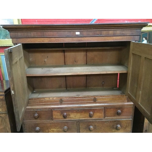 1581 - A George III Welsh oak housekeeper's press cupboard, outswept cornice above a pair of rectangular do... 