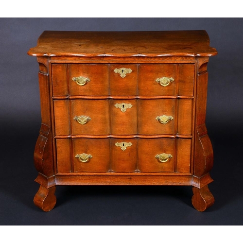 1584 - A Dutch oak shaped serpentine commode, of small proportions, three long graduated drawers, 80cm high... 