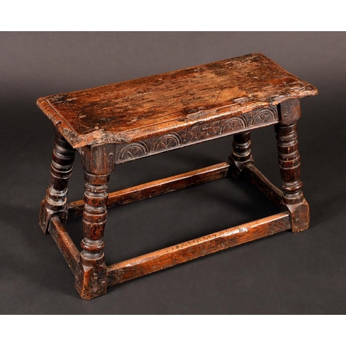 1585 - An '18th century' oak joint stool, oversailing top above a lunette frieze, turned legs, rectangular ... 