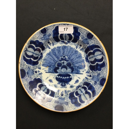 17 - An 18th century Delft plate, in underglaze blue with fan of peacock feathers, 22.5cm diam, c.1760