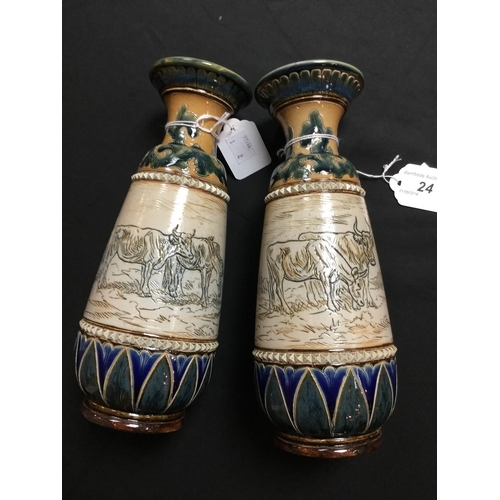 24 - A pair of Doulton Lambeth baluster vases, by Hannah Barlow, monogrammed, incised with grazing horses... 