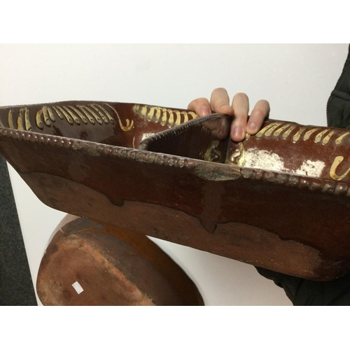 5 - A 19th century Slipware rounded rectangular dish, decorated in typical manner with geometric devices... 