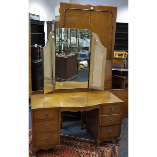 129 - A Warring and Gillows burr walnut bedroom suite comprising single wardrobe, triptych mirrored dressi... 