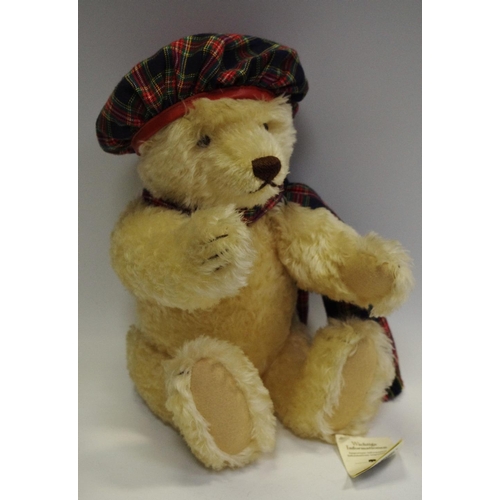 23 - A Steiff teddy bear, with 'growling' mechanism, tartan dress, with labels