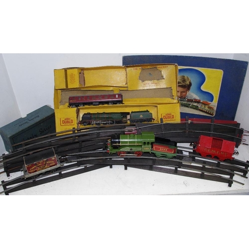 65 - Hornby - an O' Gauge clockwork locomotive, 0-4-0 and tender, rolling stock, including AR cement wago... 