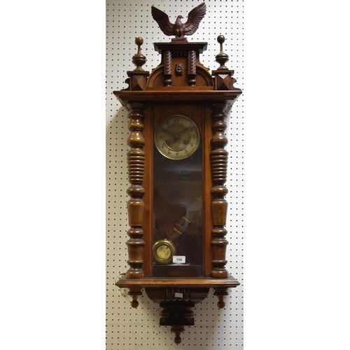 150 - A Victorian Walnut Vienna Wall Clock, surmounted by an eagle.