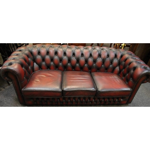 162 - A Reception Sang De Boeuf Chesterfield Settee, 204cm wide.