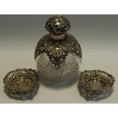 210 - A Victorian silver mounted cut glass globular scent bottle, domed cover and sides, embossed and pier... 