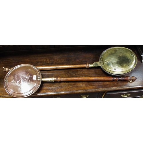 113 - A brass and copper warming pan; another copper circa 1810