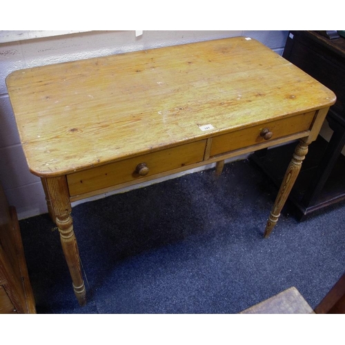 341 - A pine country kitshen table, rounded rectangular top, two short drawers to frieze, turned pitch pin... 