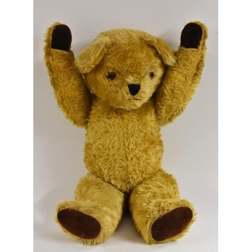 3073 - A large musical clockwork Teddy Bear, possibly Merrythought, golden centre seamed body, glass and fe... 