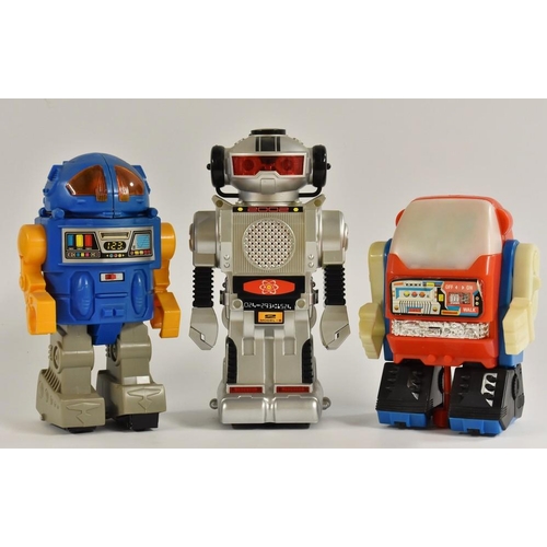 3089 - Robots - a retro New Bright Toys Morgan TR 2 battery operated bump and go robot, silver and black bo... 