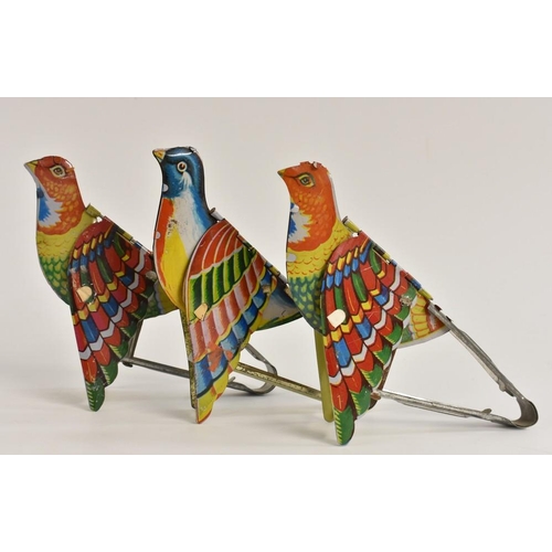 3093 - A set of three mechanical squeeze action tin plate bird calls, under wing bellows sound tubes, indiv... 