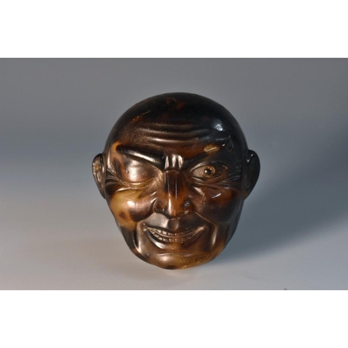 1141 - A 19th century carved tortoiseshell gentleman's walking cane handle, as a bald headed man, winking a... 