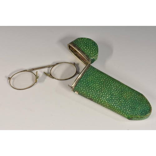 1151 - A George III silver-mounted and green shagreen spectacles case, hinged canted cover with inset monog... 