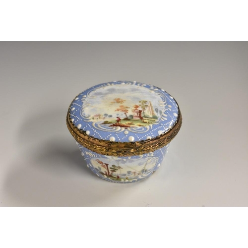 1153 - A George III South Staffordshire enamel basket shaped patch box, painted with picturesque landscape ... 