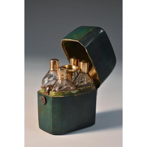 1166 - An 18th century French gold-fitted green shagreen fragrance etui, enclosing a fitted arrangement of ... 