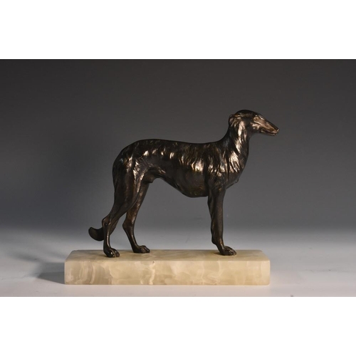 1229 - French School (early 20th century), a dark patinated bronze, of a hound, rectangular onyx base, 18cm... 