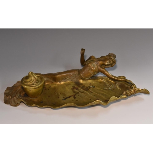 1231 - French School (early 20th century), a brown and gilt patinated bronze figural desk stand, cast with ... 