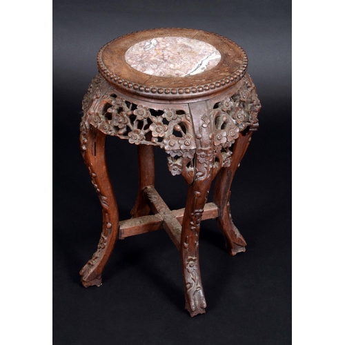 1240 - A Chinese hardwood jardiniere stand, circular top with inset soapstone panel, beaded border above a ... 