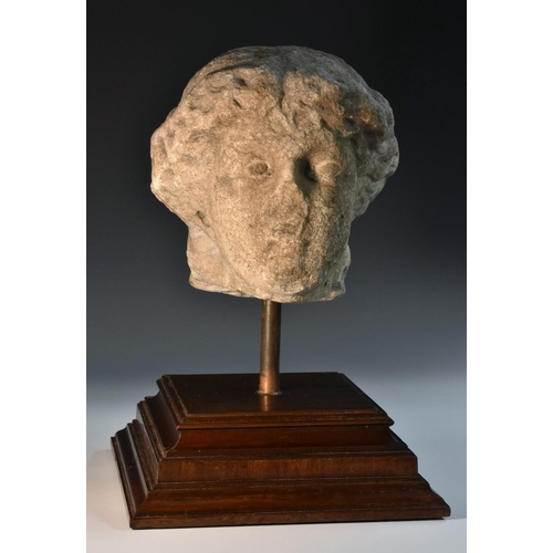 1249 - Antiquities - a Roman marble sculptural fragment, the head of a woman, 20cm high, mounted for displa... 