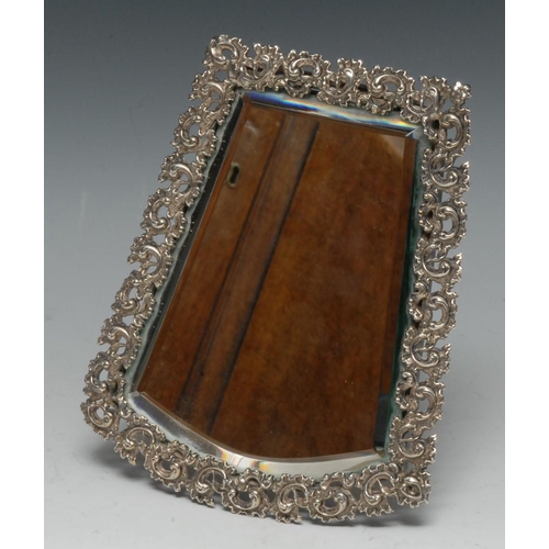 1254 - An unusual Continental silver coloured metal metamorphic dressing table mirror, the handle folding t... 