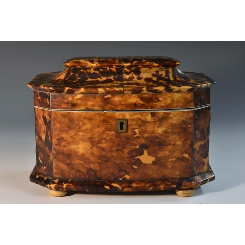 1270 - An early Victorian tortoiseshell canted bow fronted tea caddy, hinged pagoda top enclosing a pair of... 