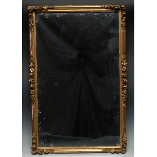 1280 - An early 20th century rectangular mirror, with flowers to angles, 49cm x 76cm