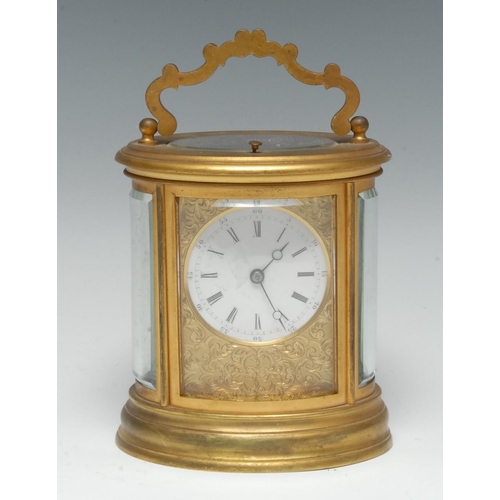 1286 - A 19th century gilt brass oval carriage clock, 6cm circular enamel dial with Roman and subsidiary Ar... 