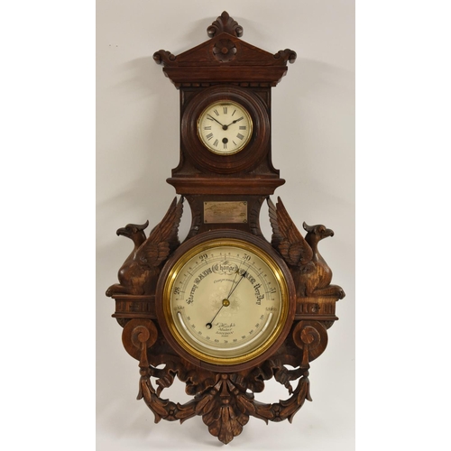 1288 - A late Victorian oak wall aneroid barometer, with alcohol thermometer and clock, signed J. Hicks/mak... 