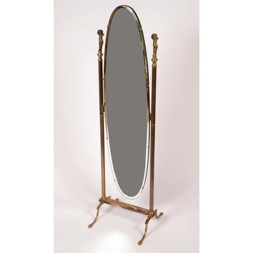 1290 - An early 20th century brass cheval mirror, oval bevelled plate flanked by reeded columns terminating... 