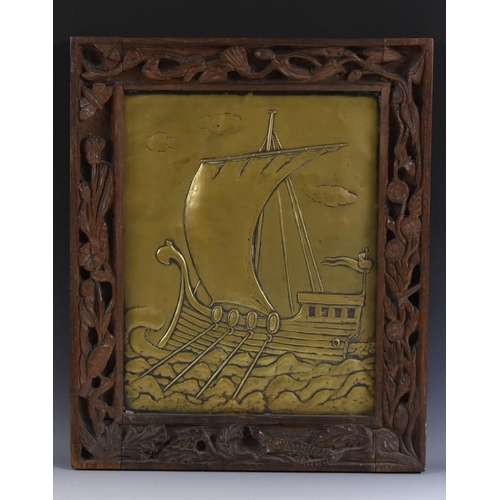 1309 - An Arts and Crafts brass rectangular panel, embossed with a longship sailing choppy seas, traces of ... 